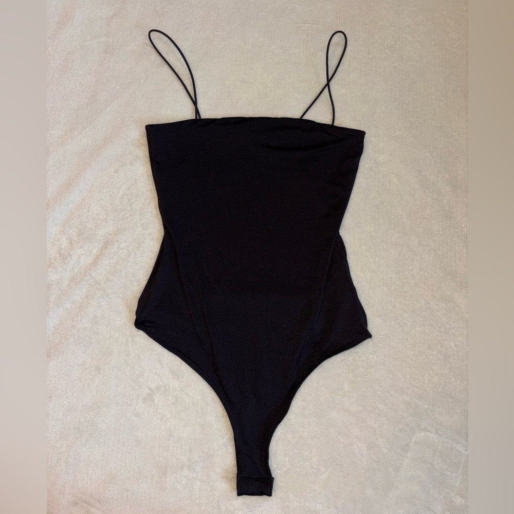 woman’s black bodysuit
